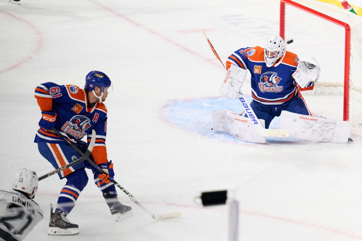Ontario reign forward Glenn Gawdin (21) shoots a goal attempt during an AHL hockey game against the Bakersfield Condors, Friday November 21, 2025 in Ontario, Calif. Ontario reign forward Glenn Gawdin (21) shoots a goal attempt during an AHL hockey game against the Bakersfield Condors, Friday November 21, 2025 in Ontario, Calif.