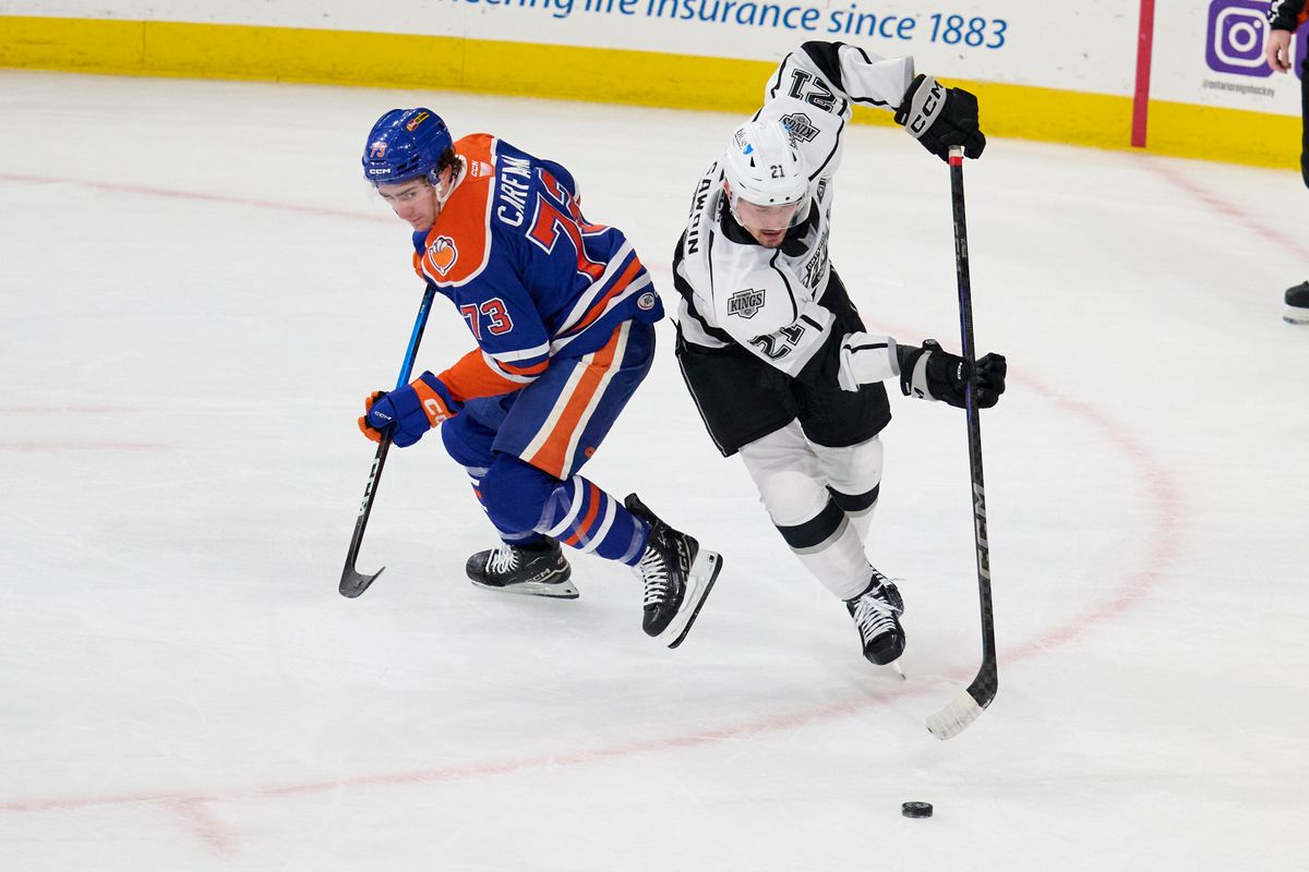 Ontario reign forward Glenn Gawdin (21) gains possession during an AHL hockey game against the Bakersfield Condors, Friday November 21, 2025 in Ontario, Calif. Ontario reign forward Glenn Gawdin (21) gains possession during an AHL hockey game against the Bakersfield Condors, Friday November 21, 2025 in Ontario, Calif.