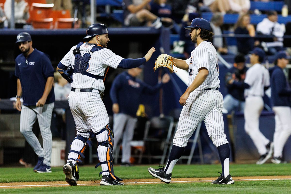 CSUF Titans pitcher Moriah Negrete (4) and catcher Max Ortega (36) react after an inning-ending strikeout during an NCAA Baseball game against the CBU Lancers on February 13, 2026 in Fullerton, California. CSUF Titans pitcher Moriah Negrete (4) and catcher Max Ortega (36) react after an inning-ending strikeout during an NCAA Baseball game against the CBU Lancers on February 13, 2026 in Fullerton, California.