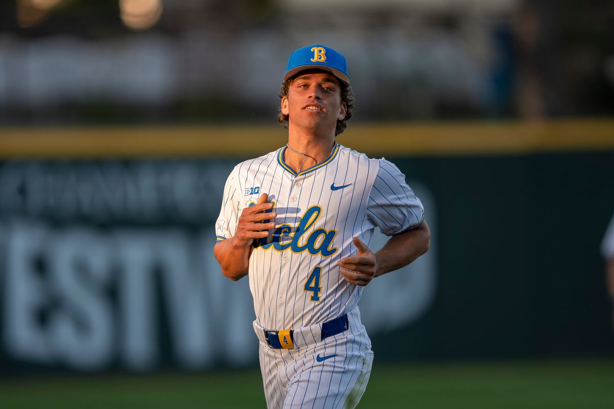 UCLA infielder, Phoenix Call (4) retrieving his glove during a NCAA baseball game against UC San Diego on February 13, 2026 at Jackie Robinson Stadium in Los Angeles, CA. UCLA infielder, Phoenix Call (4) retrieving his glove during a NCAA baseball game against UC San Diego on February 13, 2026 at Jackie Robinson Stadium in Los Angeles, CA.