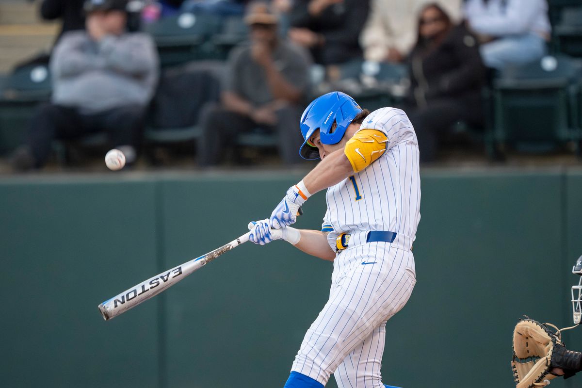 UCLA infielder, Roch Cholowsky (1) at bat, mid hit during a NCAA baseball game against UC San Diego on February 13, 2026 at Jackie Robinson Stadium in Los Angeles, CA. UCLA infielder, Roch Cholowsky (1) at bat, mid hit during a NCAA baseball game against UC San Diego on February 13, 2026 at Jackie Robinson Stadium in Los Angeles, CA.