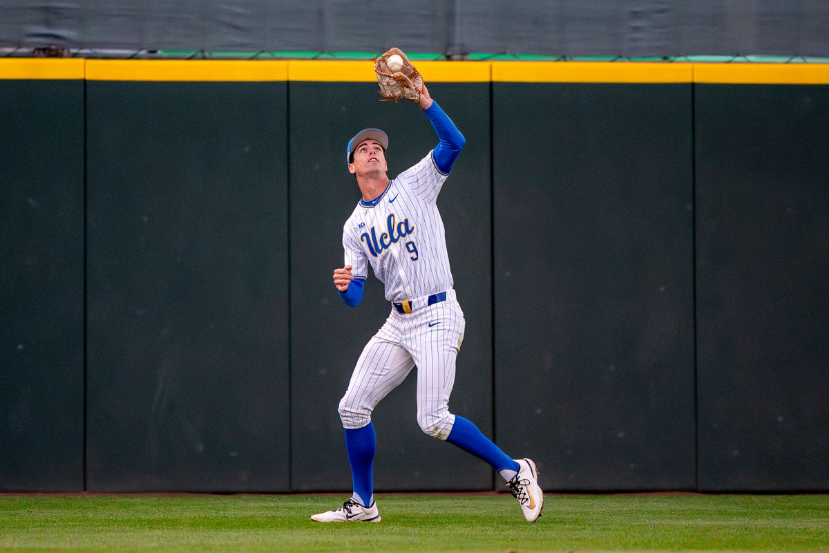 UCLA outfielder, Will Gasparino (9) catching a fly ball during a NCAA baseball game against UC San Diego on February 13, 2026 at Jackie Robinson Stadium in Los Angeles, CA. UCLA outfielder, Will Gasparino (9) catching a fly ball during a NCAA baseball game against UC San Diego on February 13, 2026 at Jackie Robinson Stadium in Los Angeles, CA.