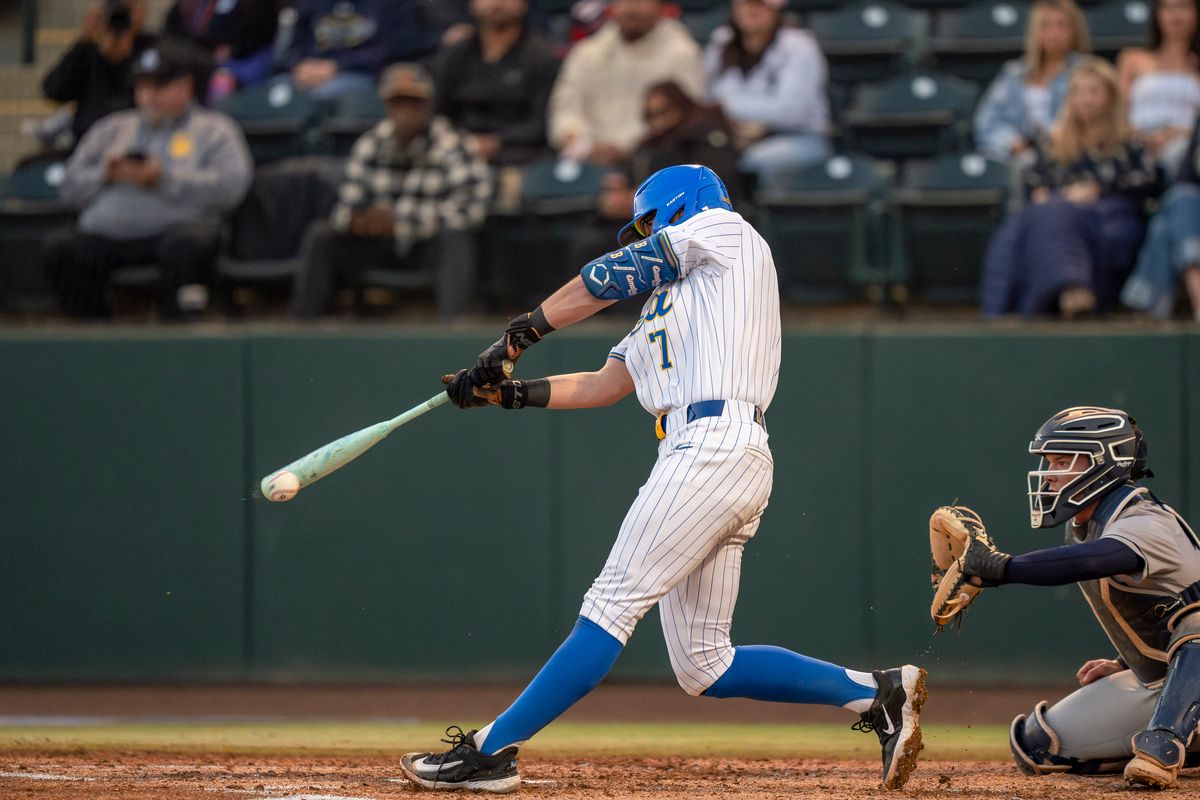 UCLA infielder, Roman Martin (7) at bat, mid-hit during a NCAA baseball game against UC San Diego on February 13, 2026 at Jackie Robinson Stadium in Los Angeles, CA. UCLA infielder, Roman Martin (7) at bat, mid-hit during a NCAA baseball game against UC San Diego on February 13, 2026 at Jackie Robinson Stadium in Los Angeles, CA.