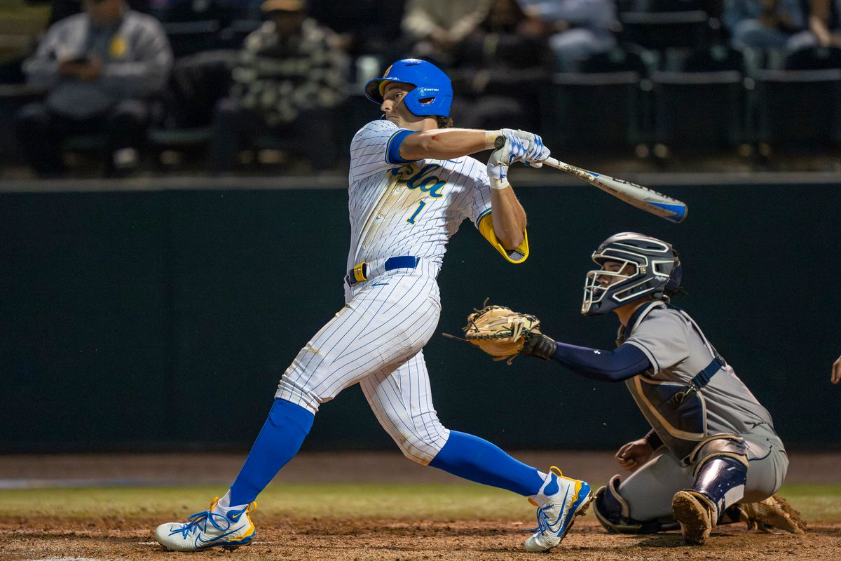 UCLA infielder, Roch Cholowsky (1) at bat, mid-hit during a NCAA baseball game against UC San Diego on February 13, 2026 at Jackie Robinson Stadium in Los Angeles, CA. UCLA infielder, Roch Cholowsky (1) at bat, mid-hit during a NCAA baseball game against UC San Diego on February 13, 2026 at Jackie Robinson Stadium in Los Angeles, CA.