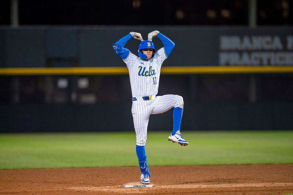 UCLA outfielder, Peyton Brennan (11) celebrating his double on second base during a NCAA baseball game against UC San Diego on February 13, 2026 at Jackie Robinson Stadium in Los Angeles, CA. UCLA outfielder, Peyton Brennan (11) celebrating his double on second base during a NCAA baseball game against UC San Diego on February 13, 2026 at Jackie Robinson Stadium in Los Angeles, CA.