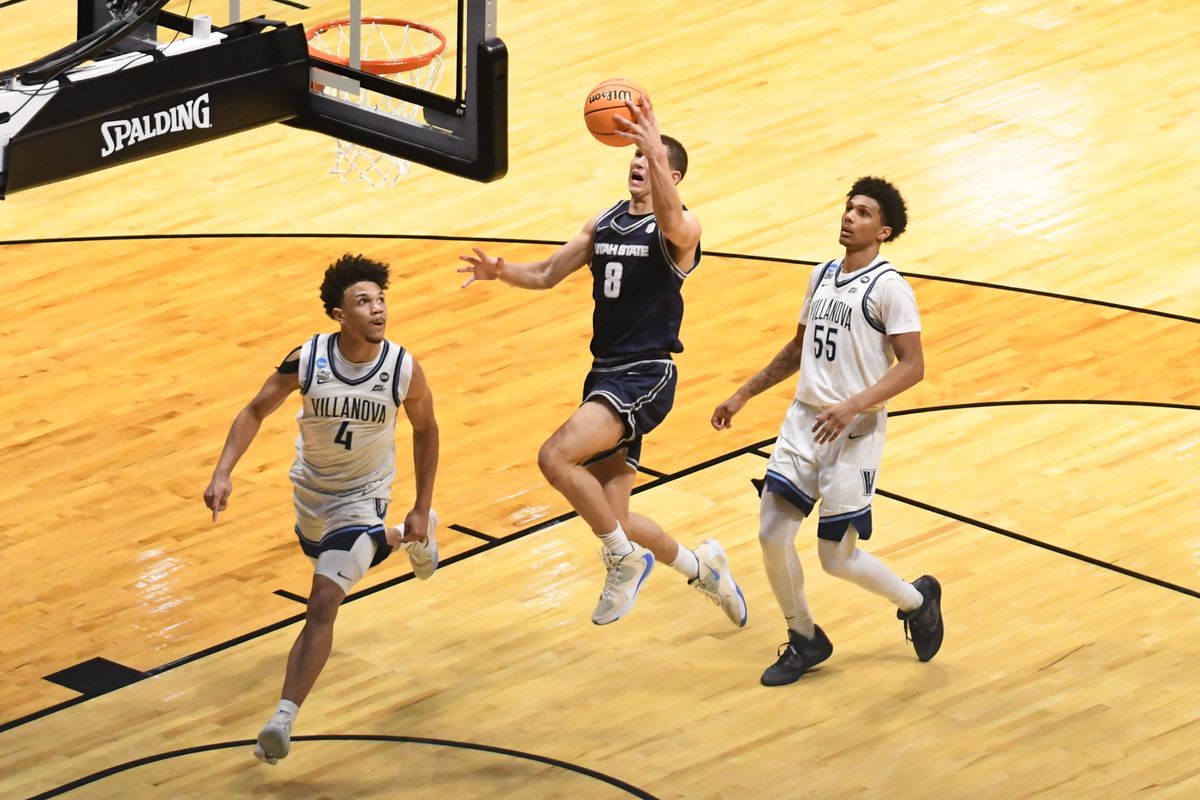 Utah State guard Drake Allen (8) drives to the basket for the shot during an NCCA March Madness game against Villanova Friday March 20, 2026 in San Diego , California. Utah State guard Drake Allen (8) drives to the basket for the shot during an NCCA March Madness game against Villanova Friday March 20, 2026 in San Diego , California.