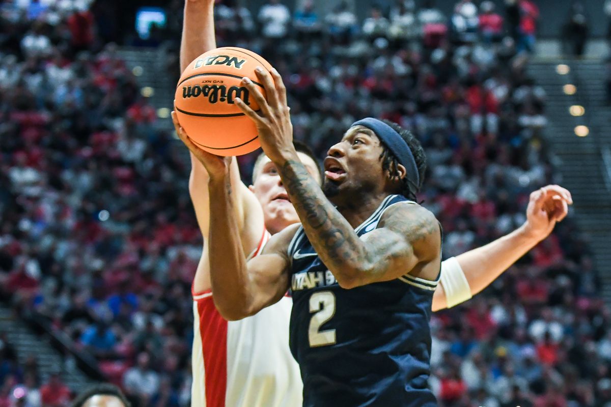 Utah State guard MJ Collins Jr. (2) makes a driving layup during an NCAA East Region second round game against Arizona Sunday March 22, 2026 in San Diego, California. Utah State guard MJ Collins Jr. (2) makes a driving layup during an NCAA East Region second round game against Arizona Sunday March 22, 2026 in San Diego, California.