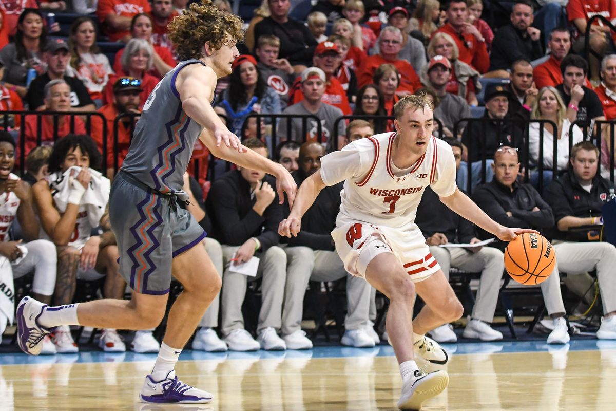Wisconsin guard Andrew Rohde (7) handles the basketball during an NCAA basketball game against TCU, Friday November 28, 2025 in San Diego, California. Wisconsin guard Andrew Rohde (7) handles the basketball during an NCAA basketball game against TCU, Friday November 28, 2025 in San Diego, California.