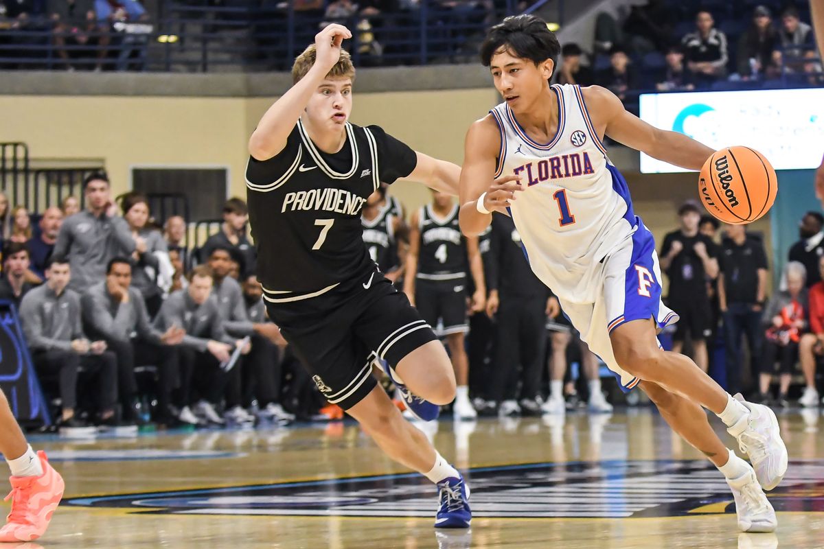Florida guard Xaivian Lee (1) dribbles past Providence guard Stefan Vaaks (7) during an NCAA basketball game against Providence Friday November 28, 2025 in San Diego, California. Florida guard Xaivian Lee (1) dribbles past Providence guard Stefan Vaaks (7) during an NCAA basketball game against Providence Friday November 28, 2025 in San Diego, California.