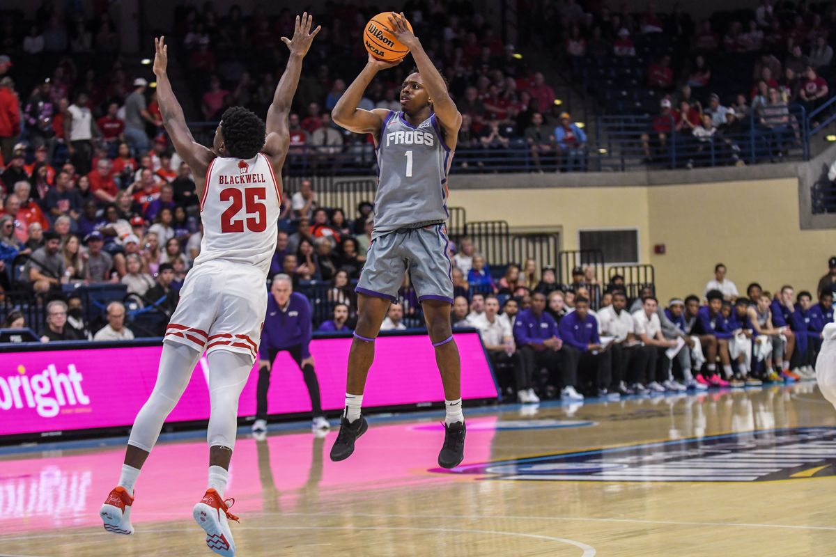 TCU guard Jayden Pierre (1) shoots a three point shot over Wisconsin guard John Blackwell (25) during an NCAA basketball game against Wisconsin, Friday November 28, 2025 in San Diego, California. TCU guard Jayden Pierre (1) shoots a three point shot over Wisconsin guard John Blackwell (25) during an NCAA basketball game against Wisconsin, Friday November 28, 2025 in San Diego, California.