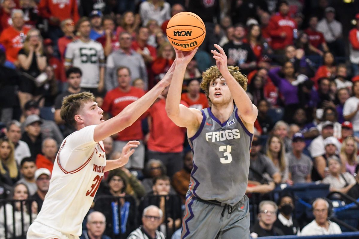 TCU guard Liutauras Lelevicius (3) takes a shot over Wisconsin forward Nolan Winter (31) during an NCAA basketball game against Wisconsin,Friday November 28, 2025 in San Diego, California. TCU guard Liutauras Lelevicius (3) takes a shot over Wisconsin forward Nolan Winter (31) during an NCAA basketball game against Wisconsin,Friday November 28, 2025 in San Diego, California.