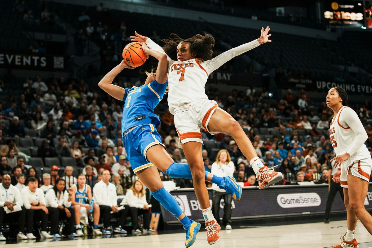 Texas guard Bryanna Preston (1) attempts to block a shot from UCLA Kiki Rice during second half of college basketball game against UCLA on Wednesday, Nov. 26, 2025 during the Players Era tournament at Michelob Ultra Arena in Las Vegas. Texas guard Bryanna Preston (1) attempts to block a shot from UCLA Kiki Rice during second half of college basketball game against UCLA on Wednesday, Nov. 26, 2025 during the Players Era tournament at Michelob Ultra Arena in Las Vegas.