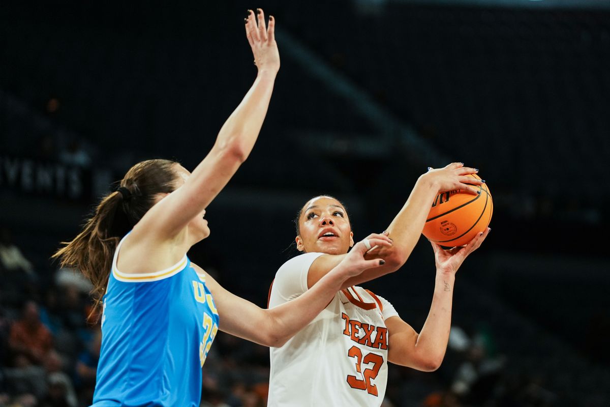 Texas forward Teya Sidberry (32) eyes the basket while guarded by UCLA Angela Dugalic (32) during first half of college basketball game against UCLA on Wednesday, Nov. 26, 2025 during the Players Era tournament at Michelob Ultra Arena in Las Vegas. Texas forward Teya Sidberry (32) eyes the basket while guarded by UCLA Angela Dugalic (32) during first half of college basketball game against UCLA on Wednesday, Nov. 26, 2025 during the Players Era tournament at Michelob Ultra Arena in Las Vegas.