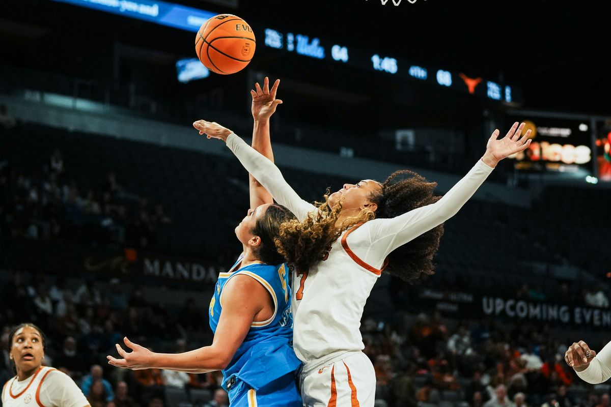 Texas guard Jordan Lee (7) attempts to block a shot from UCLA Charlisse Leger-Walker (5) during second half of college basketball game against UCLA on Wednesday, Nov. 26, 2025 during the Players Era tournament at Michelob Ultra Arena in Las Vegas. Texas guard Jordan Lee (7) attempts to block a shot from UCLA Charlisse Leger-Walker (5) during second half of college basketball game against UCLA on Wednesday, Nov. 26, 2025 during the Players Era tournament at Michelob Ultra Arena in Las Vegas.