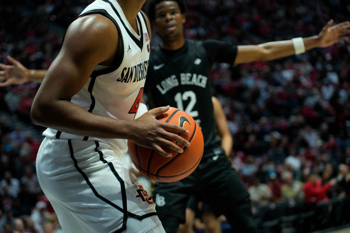 San Diego State guard Sean Newman Jr. (4) waits to pass the ball during an NCAA Basketball game against Long Beach State, Tuesday November 4, 2025 in San Diego, Calif. San Diego State guard Sean Newman Jr. (4) waits to pass the ball during an NCAA Basketball game against Long Beach State, Tuesday November 4, 2025 in San Diego, Calif.