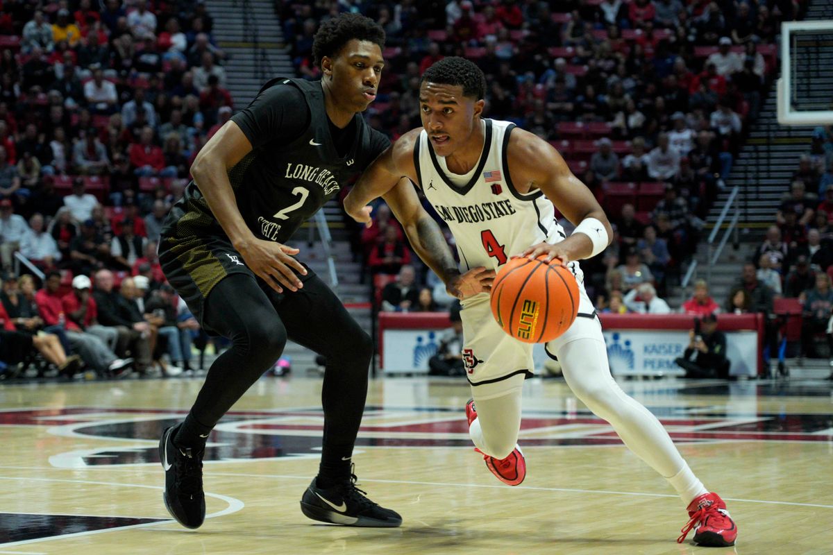 San Diego State guard Sean Newman Jr. (4) drives during an NCAA Basketball game against Long Beach State, Tuesday November 4, 2025 in San Diego, Calif. San Diego State guard Sean Newman Jr. (4) drives during an NCAA Basketball game against Long Beach State, Tuesday November 4, 2025 in San Diego, Calif.