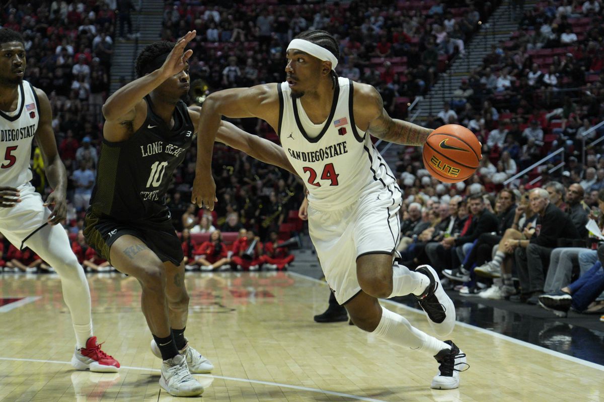 San Diego State guard Taj DeGourville (24) drives during an NCAA Basketball game against Long Beach State, Tuesday November 4, 2025 in San Diego, Calif. San Diego State guard Taj DeGourville (24) drives during an NCAA Basketball game against Long Beach State, Tuesday November 4, 2025 in San Diego, Calif.