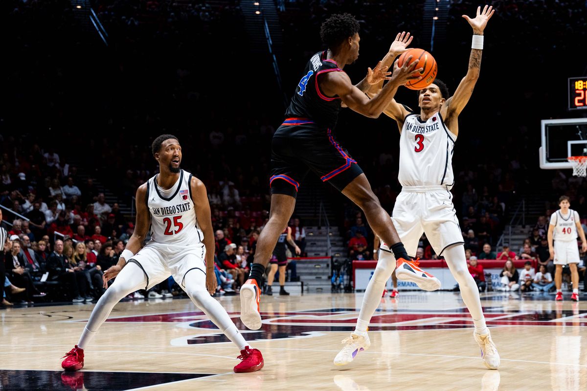 San Diego State guard Elzie Harrington (3) and forward Jeremiah Oden (25) guard Boise State guard Dylan Andrews (4) during an NCAA Basketball game between Boise State and San Diego State, Saturday January 3, 2026 at Viejas Arena in San Diego, Calif. San Diego State guard Elzie Harrington (3) and forward Jeremiah Oden (25) guard Boise State guard Dylan Andrews (4) during an NCAA Basketball game between Boise State and San Diego State, Saturday January 3, 2026 at Viejas Arena in San Diego, Calif.
