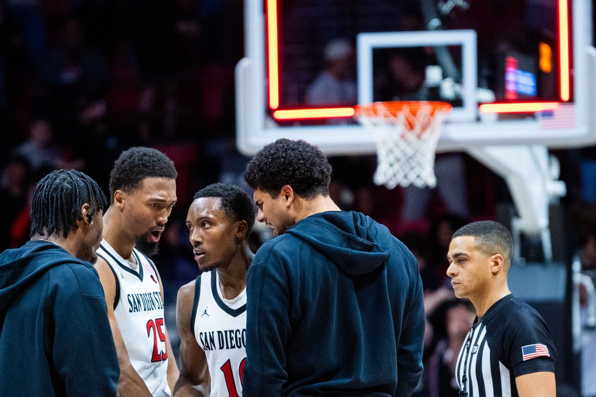 San Diego State guard BJ Davis (10) stands with teammates after making a buzzer beater to send the game to overtime during an NCAA Basketball game between Boise State and San Diego State, Saturday January 3, 2026 at Viejas Arena in San Diego, Calif. San Diego State guard BJ Davis (10) stands with teammates after making a buzzer beater to send the game to overtime during an NCAA Basketball game between Boise State and San Diego State, Saturday January 3, 2026 at Viejas Arena in San Diego, Calif.
