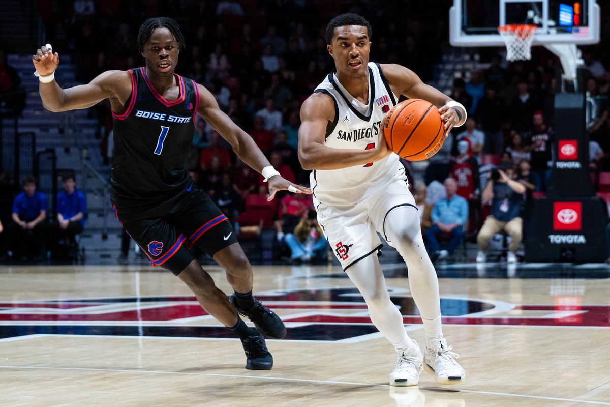 San Diego State guard Sean Newman Jr. (4) passes during an NCAA Basketball game between Boise State and San Diego State, Saturday January 3, 2026 at Viejas Arena in San Diego, Calif. San Diego State guard Sean Newman Jr. (4) passes during an NCAA Basketball game between Boise State and San Diego State, Saturday January 3, 2026 at Viejas Arena in San Diego, Calif.