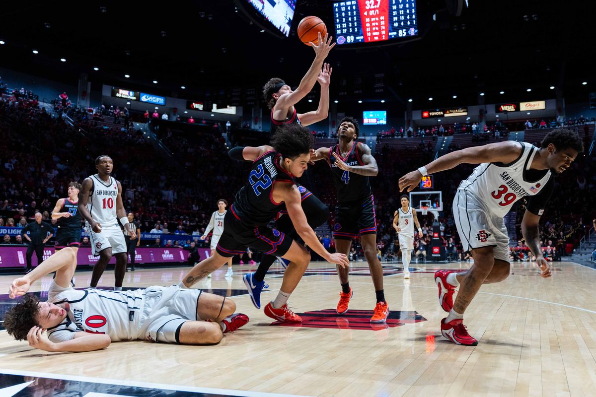 Players fight for the ball during an NCAA Basketball game between Boise State and San Diego State, Saturday January 3, 2026 at Viejas Arena in San Diego, Calif. Players fight for the ball during an NCAA Basketball game between Boise State and San Diego State, Saturday January 3, 2026 at Viejas Arena in San Diego, Calif.