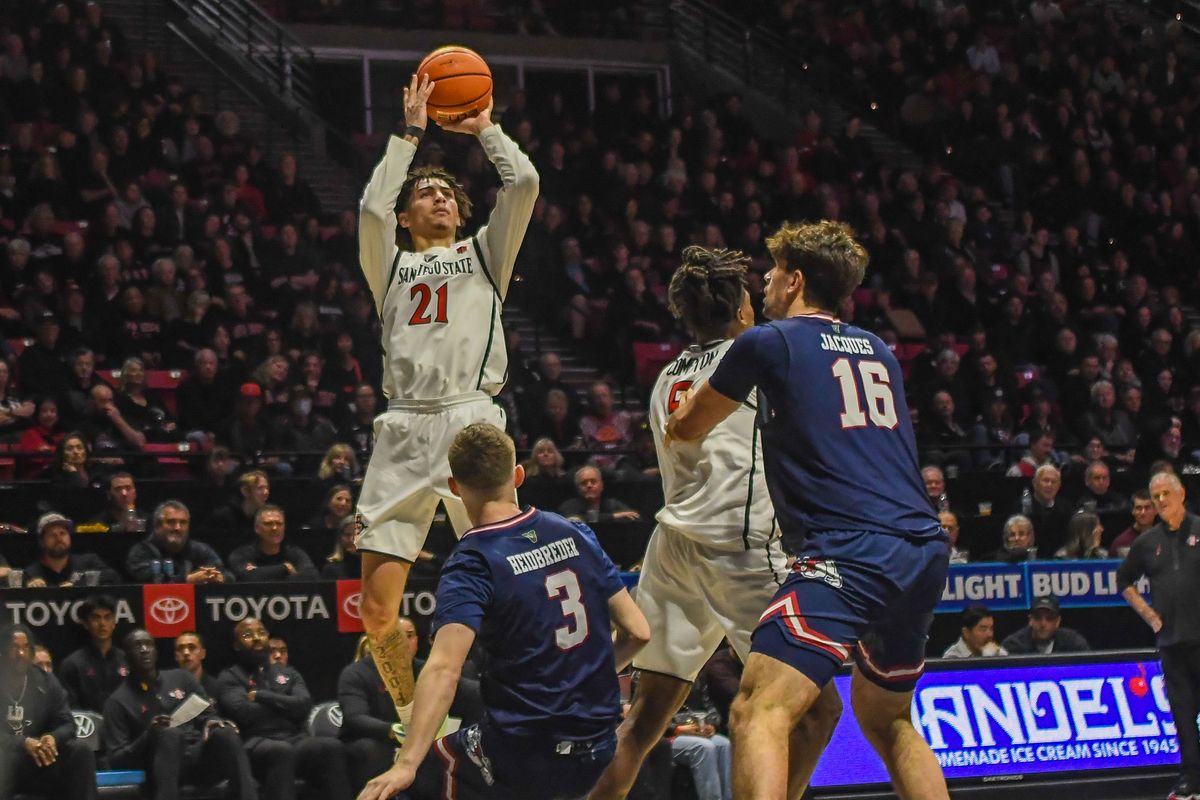 SDSU Miles Byrd (21) rises over Fresno State Jake Heidbreder (3) for the shot during an NCAA men’s basketball game against Fresno State. Saturday January 10, 2026 in San Diego, California. SDSU Miles Byrd (21) rises over Fresno State Jake Heidbreder (3) for the shot during an NCAA men’s basketball game against Fresno State. Saturday January 10, 2026 in San Diego, California.