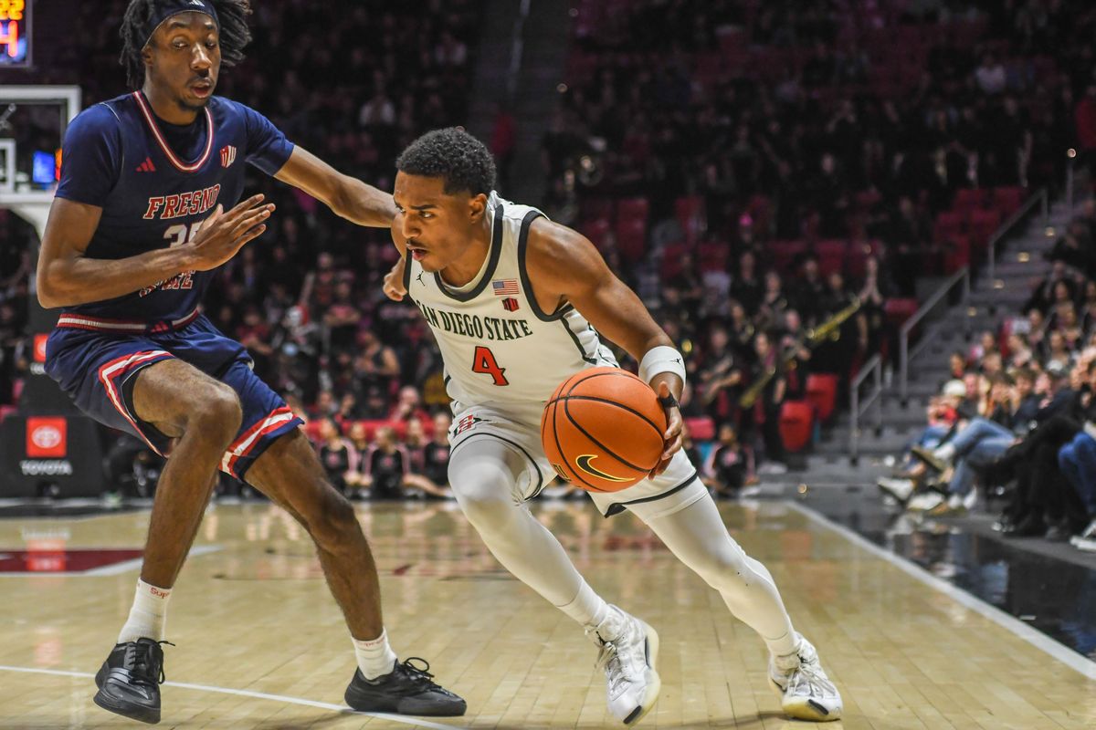 SDSU Sean Newman Jr. (4) drives to the basket during an NCAA men’s basketball game against Fresno State. Saturday January 10, 2026 in San Diego, California. SDSU Sean Newman Jr. (4) drives to the basket during an NCAA men’s basketball game against Fresno State. Saturday January 10, 2026 in San Diego, California.