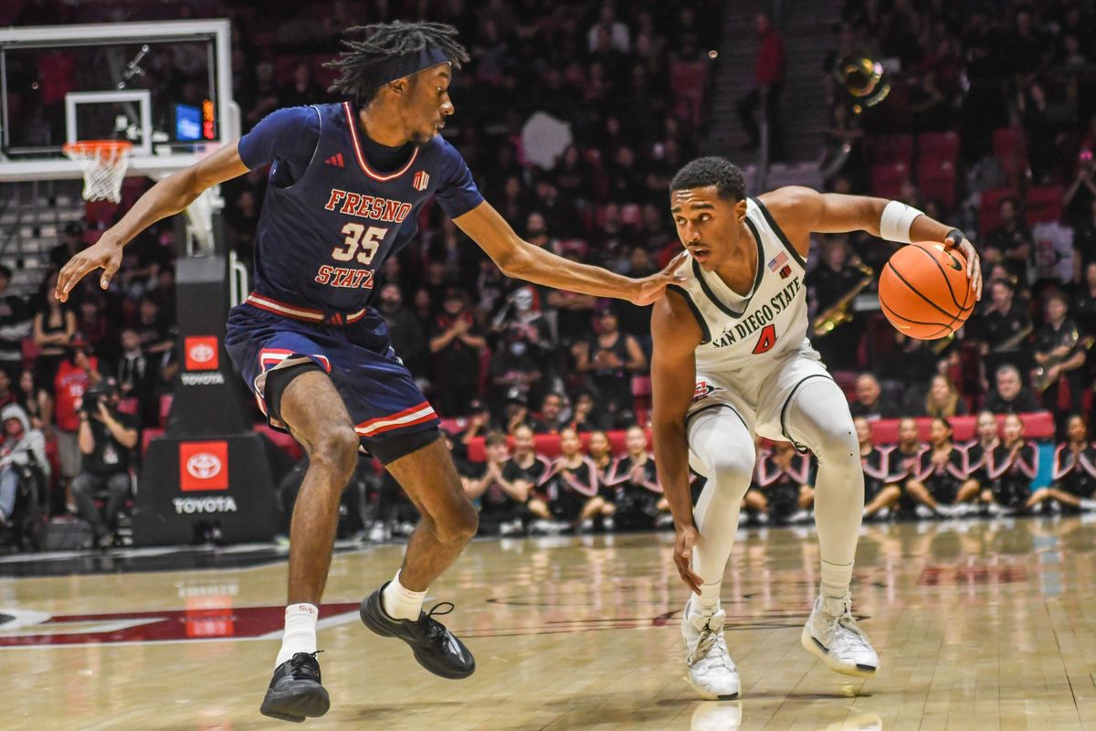 SDSU BJ Davis (10 ) handles the ball during an NCAA men’s basketball game against Fresno State. Saturday January 10, 2026 in San Diego, California. SDSU BJ Davis (10 ) handles the ball during an NCAA men’s basketball game against Fresno State. Saturday January 10, 2026 in San Diego, California.