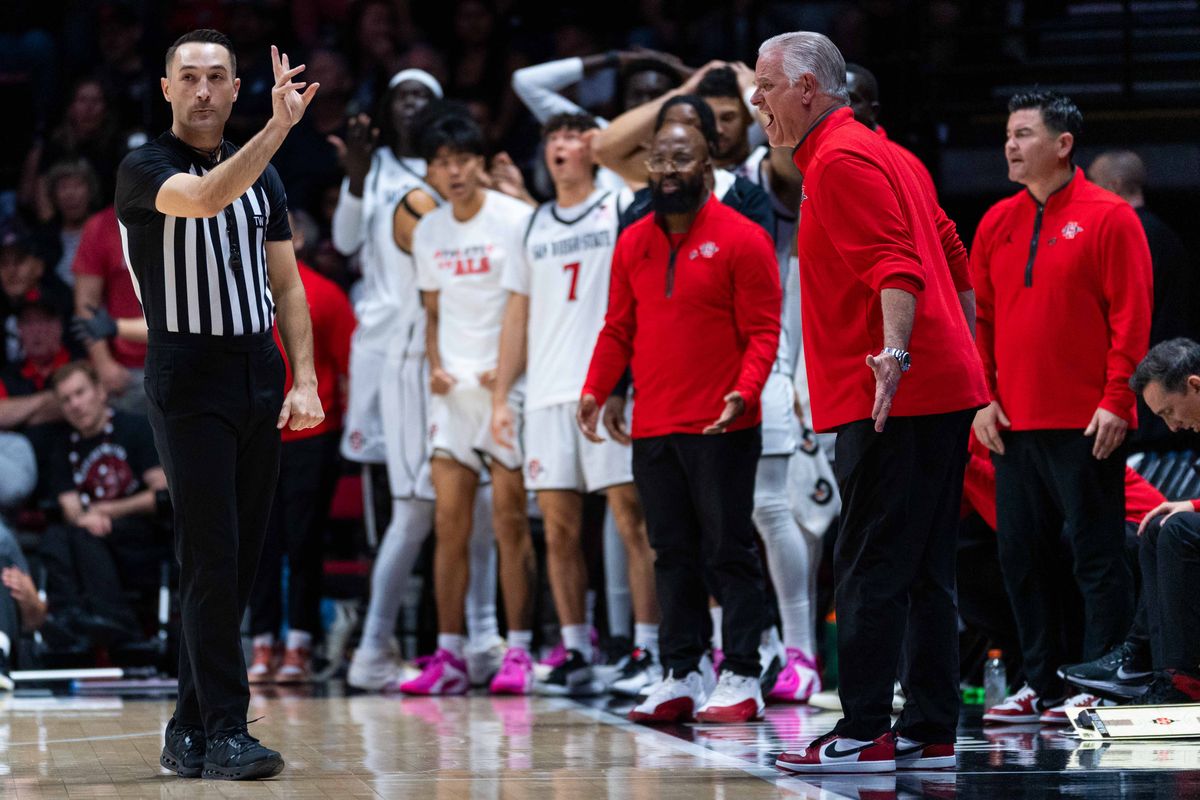 San Diego State Head Coach Brian Dutcher and the San Diego State bench react to a questionable call during an NCAA Basketball game between New Mexico and San Diego State, Saturday January 17, 2026 at Viejas Arena in San Diego, Calif. San Diego State Head Coach Brian Dutcher and the San Diego State bench react to a questionable call during an NCAA Basketball game between New Mexico and San Diego State, Saturday January 17, 2026 at Viejas Arena in San Diego, Calif.