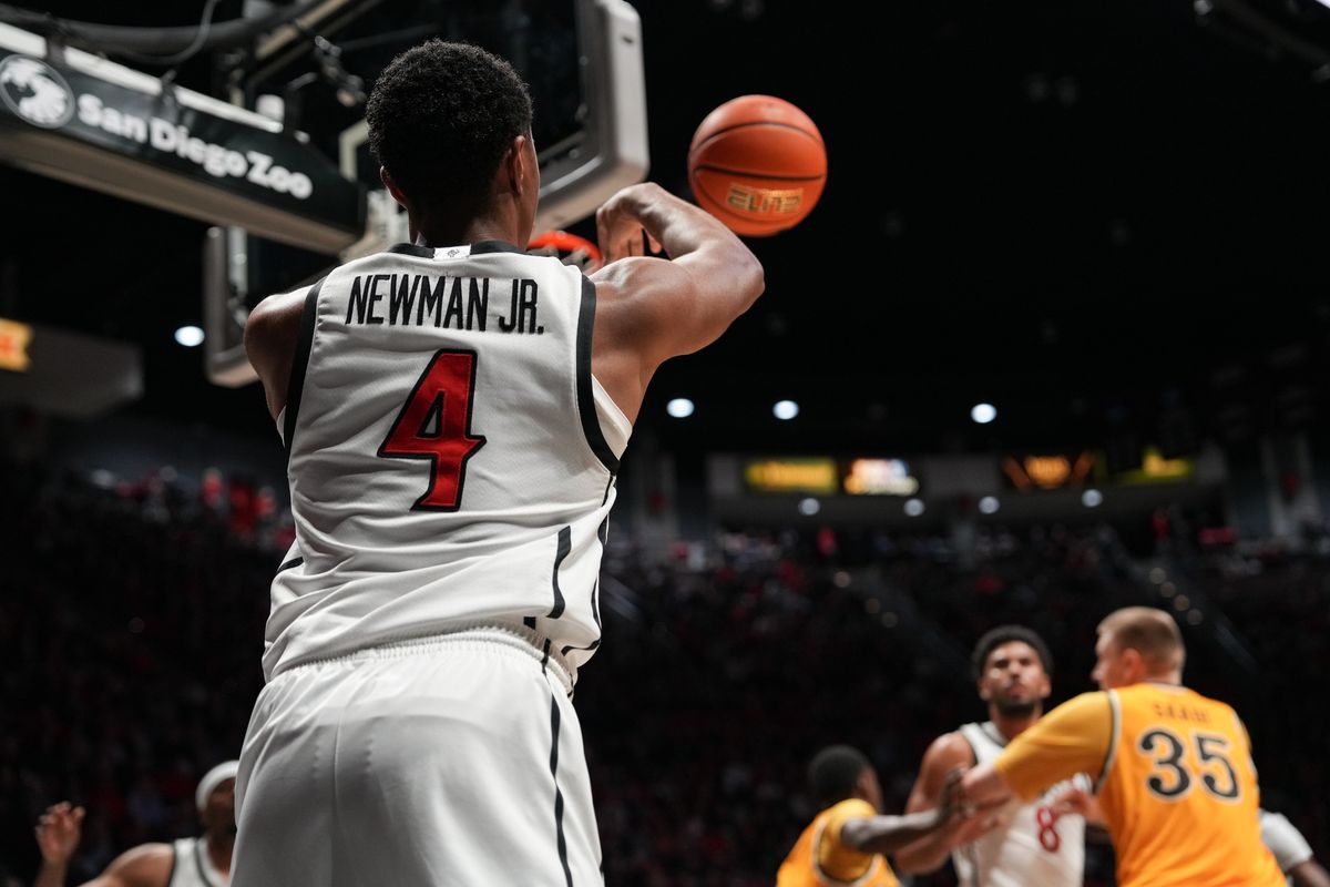 SDSU guard Sean Newman Jr. (4) passes the ball during an NCAA basketball game against Wyoming, Tuesday February 03, 2026 in San Diego, California. SDSU guard Sean Newman Jr. (4) passes the ball during an NCAA basketball game against Wyoming, Tuesday February 03, 2026 in San Diego, California.