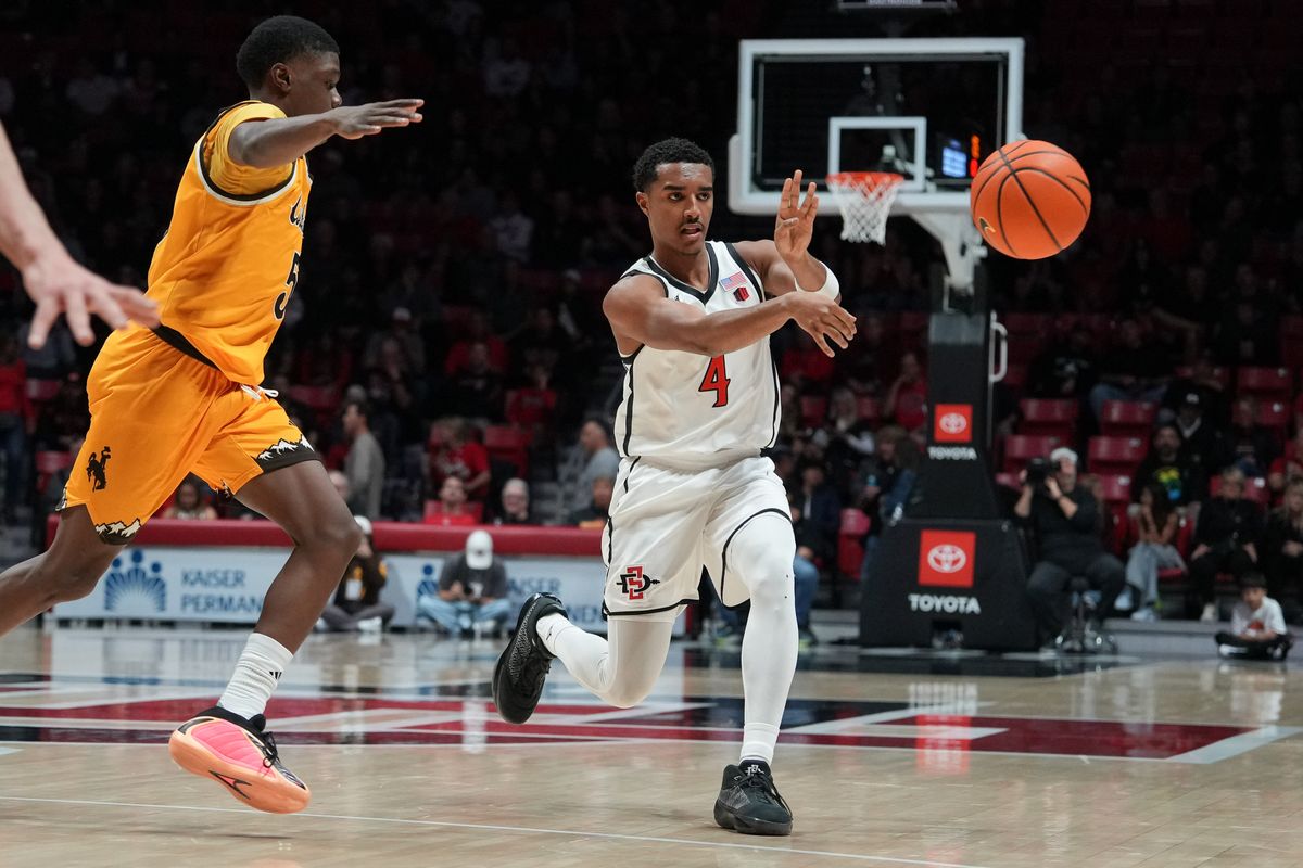 SDSU guard Sean Newman Jr. (4) passes the ball during an NCAA basketball game against Wyoming, Tuesday February 03, 2026 in San Diego, California SDSU guard Sean Newman Jr. (4) passes the ball during an NCAA basketball game against Wyoming, Tuesday February 03, 2026 in San Diego, California