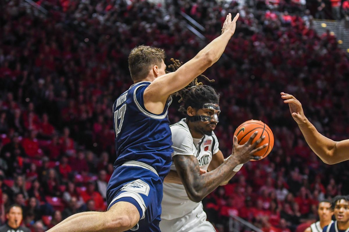 SDSU forward Pharaoh Compton (5) maneuvers to shoot during an NCAA Basketball game against Nevada Saturday February 14, 2026 in California.
