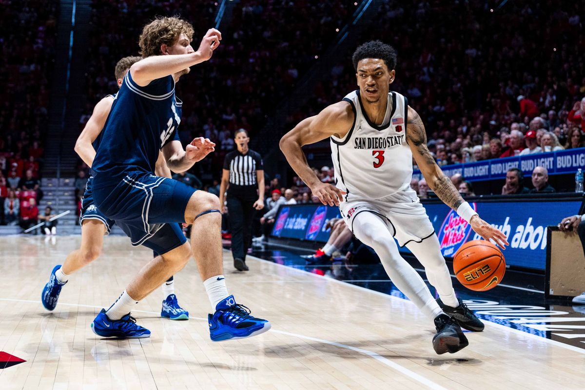 San Diego State guard Elzie Harrington (3) drives during an NCAA Basketball game between Utah State and San Diego State, Wednesday February 25, 2026 at Viejas Arena in San Diego, Calif. San Diego State guard Elzie Harrington (3) drives during an NCAA Basketball game between Utah State and San Diego State, Wednesday February 25, 2026 at Viejas Arena in San Diego, Calif.