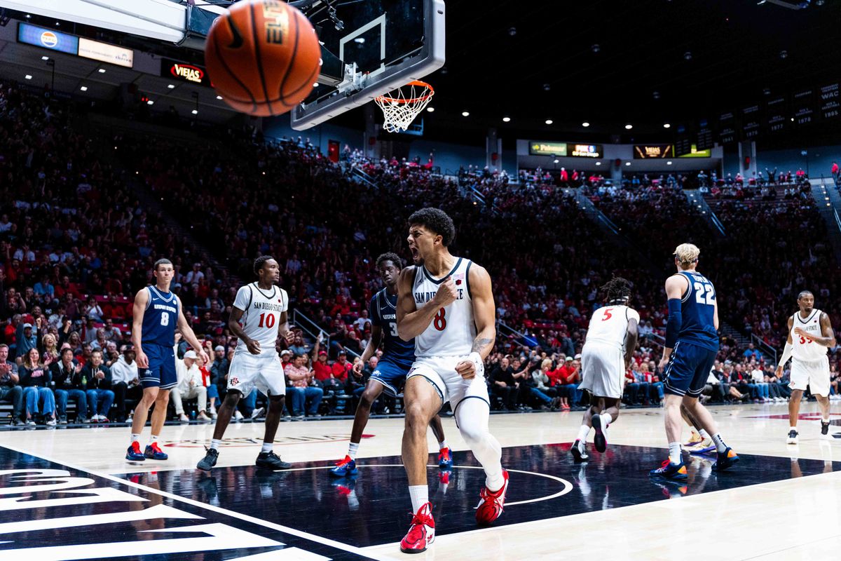 San Diego State forward Tae Simmons (8) reacts to a dunk during an NCAA Basketball game between Utah State and San Diego State, Wednesday February 25, 2026 at Viejas Arena in San Diego, Calif. San Diego State forward Tae Simmons (8) reacts to a dunk during an NCAA Basketball game between Utah State and San Diego State, Wednesday February 25, 2026 at Viejas Arena in San Diego, Calif.
