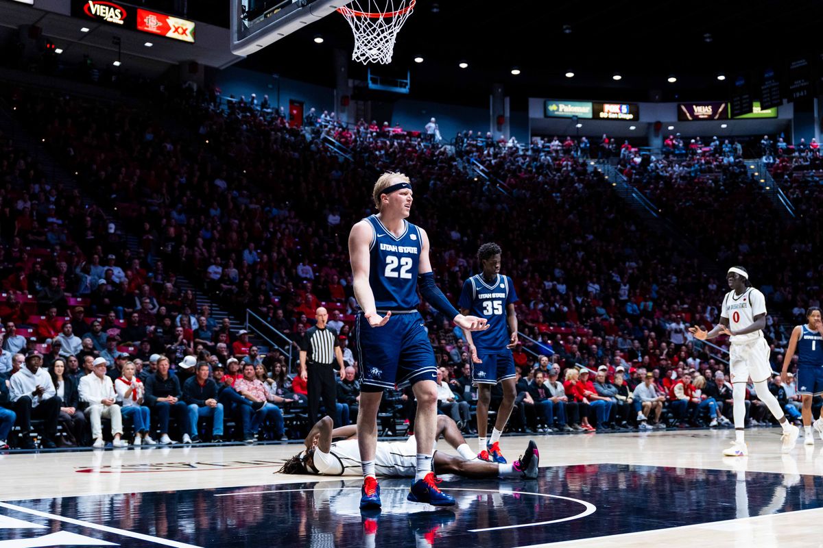 Utah State forward Karson Templin (22) reacts to being called for a foul against San Diego State forward Pharoah Compton (5) during an NCAA Basketball game between Utah State and San Diego State, Wednesday February 25, 2026 at Viejas Arena in San Diego, Calif. Utah State forward Karson Templin (22) reacts to being called for a foul against San Diego State forward Pharoah Compton (5) during an NCAA Basketball game between Utah State and San Diego State, Wednesday February 25, 2026 at Viejas Arena in San Diego, Calif.
