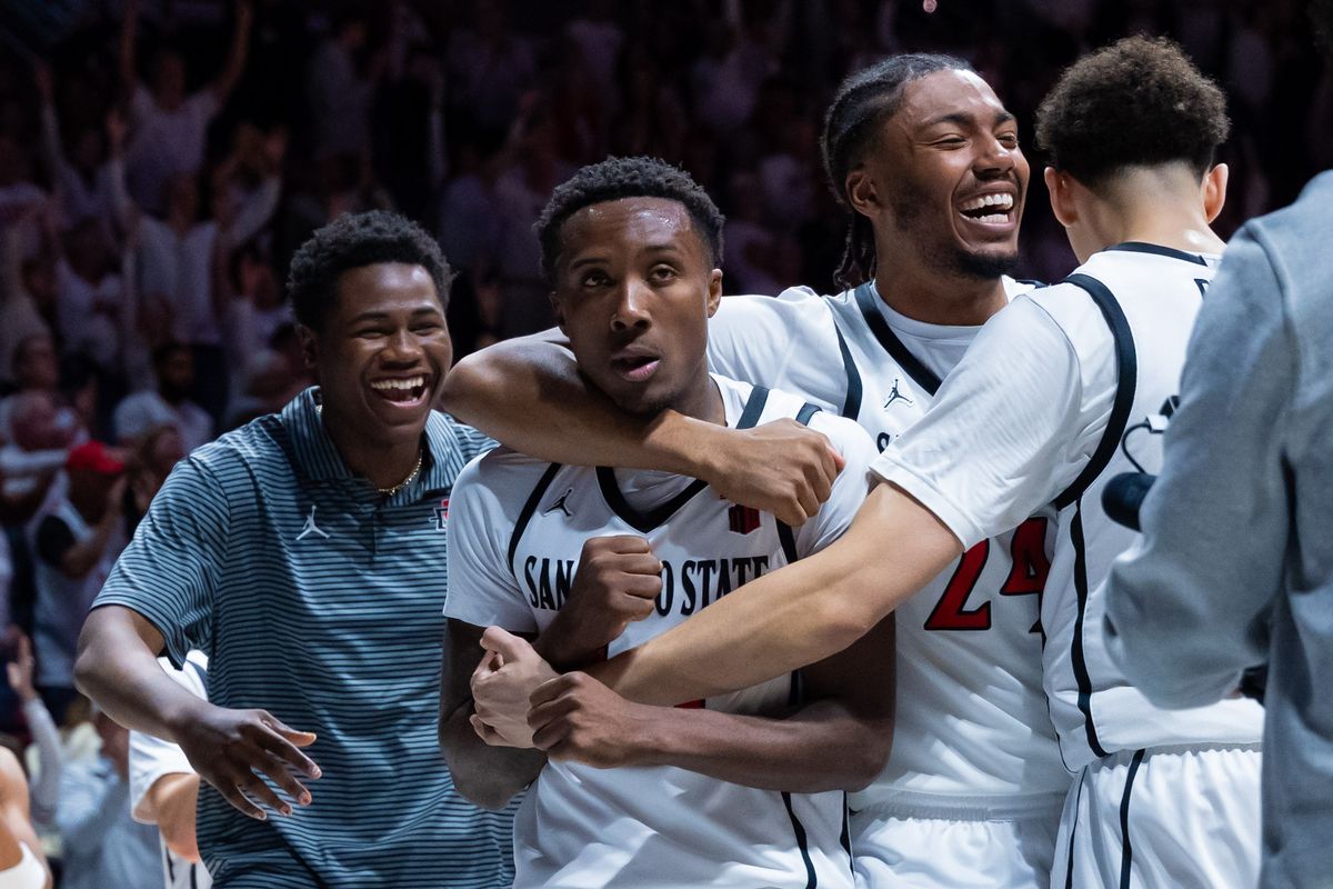 San Diego State guard Taj DeGourville (24) puts his arm around guard BJ Davis (10) during an NCAA Basketball game between UNLV and San Diego State, Friday March 6, 2026 at Viejas Arena in San Diego, Calif. San Diego State guard Taj DeGourville (24) puts his arm around guard BJ Davis (10) during an NCAA Basketball game between UNLV and San Diego State, Friday March 6, 2026 at Viejas Arena in San Diego, Calif.