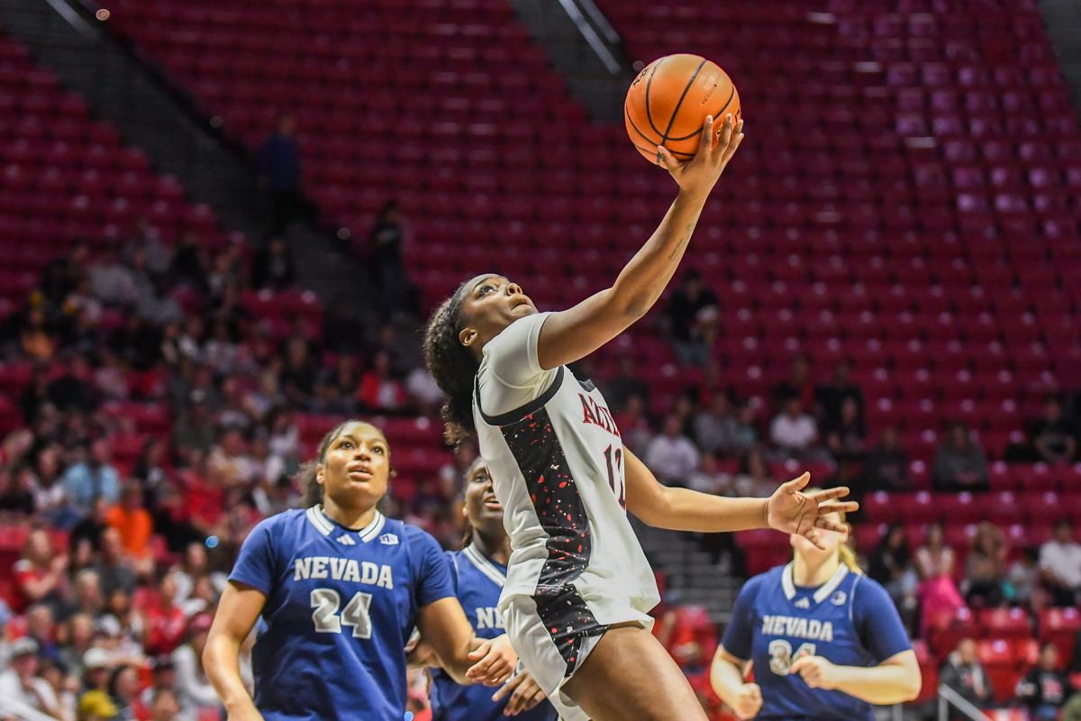 SDSU guard Kaelyn Hamilton (12) makes a driving layup during an NCAA basketball game against Nevada Saturday January 31, 2026 in San Diego, California. SDSU guard Kaelyn Hamilton (12) makes a driving layup during an NCAA basketball game against Nevada Saturday January 31, 2026 in San Diego, California.