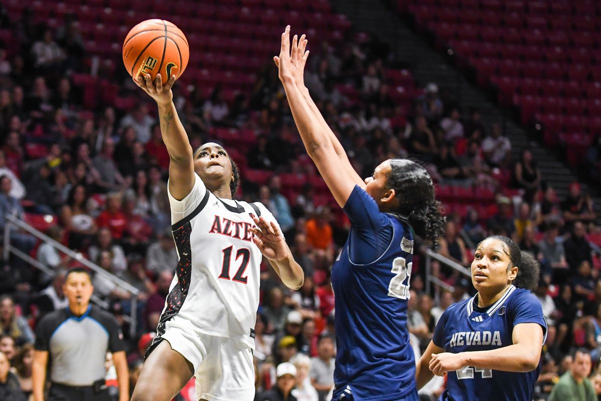 SDSU guard Kaelyn Hamilton (12) makes a running layup during an NCAA basketball game against Nevada Saturday January 31, 2026 in San Diego, California. SDSU guard Kaelyn Hamilton (12) makes a running layup during an NCAA basketball game against Nevada Saturday January 31, 2026 in San Diego, California.