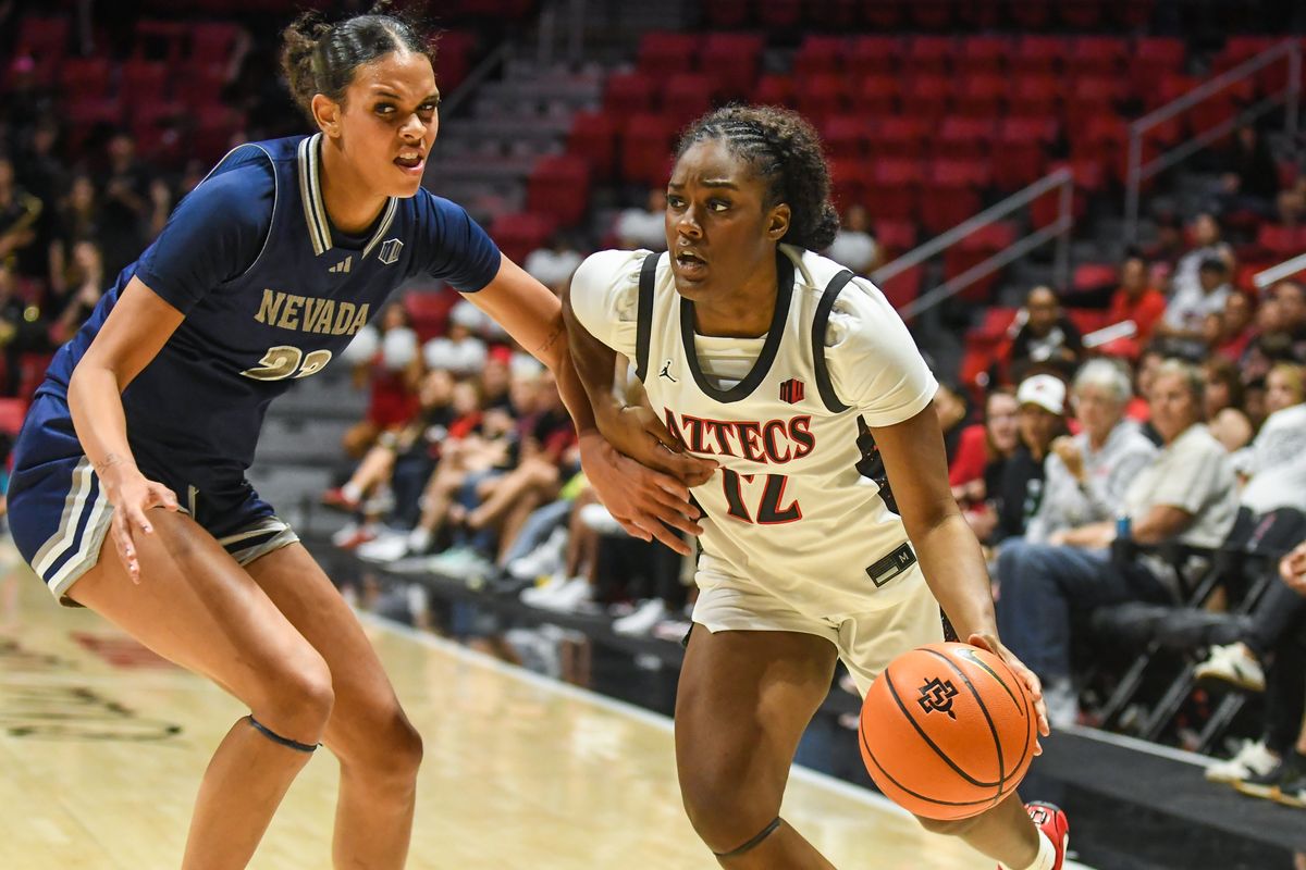 SDSU guard Kaelyn Hamilton (12) attacks the rim during an NCAA basketball game against Nevada Saturday January 31, 2026 in San Diego, California. SDSU guard Kaelyn Hamilton (12) attacks the rim during an NCAA basketball game against Nevada Saturday January 31, 2026 in San Diego, California.