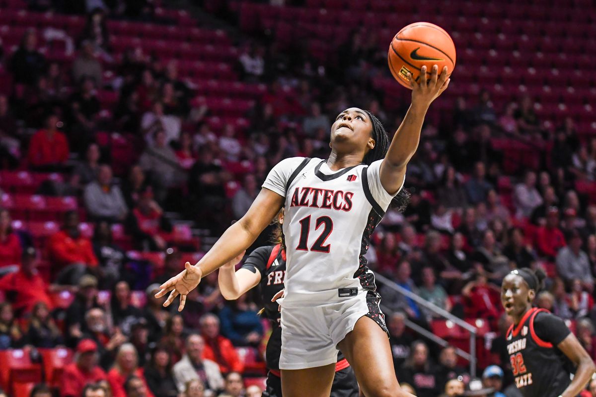 SDSU guard Kaelyn Hamilton (12) makes a driving layup during an NCAA Women’s Basketball game against Fresno State Saturday February 21, 2026 in San Diego, California. SDSU guard Kaelyn Hamilton (12) makes a driving layup during an NCAA Women’s Basketball game against Fresno State Saturday February 21, 2026 in San Diego, California.
