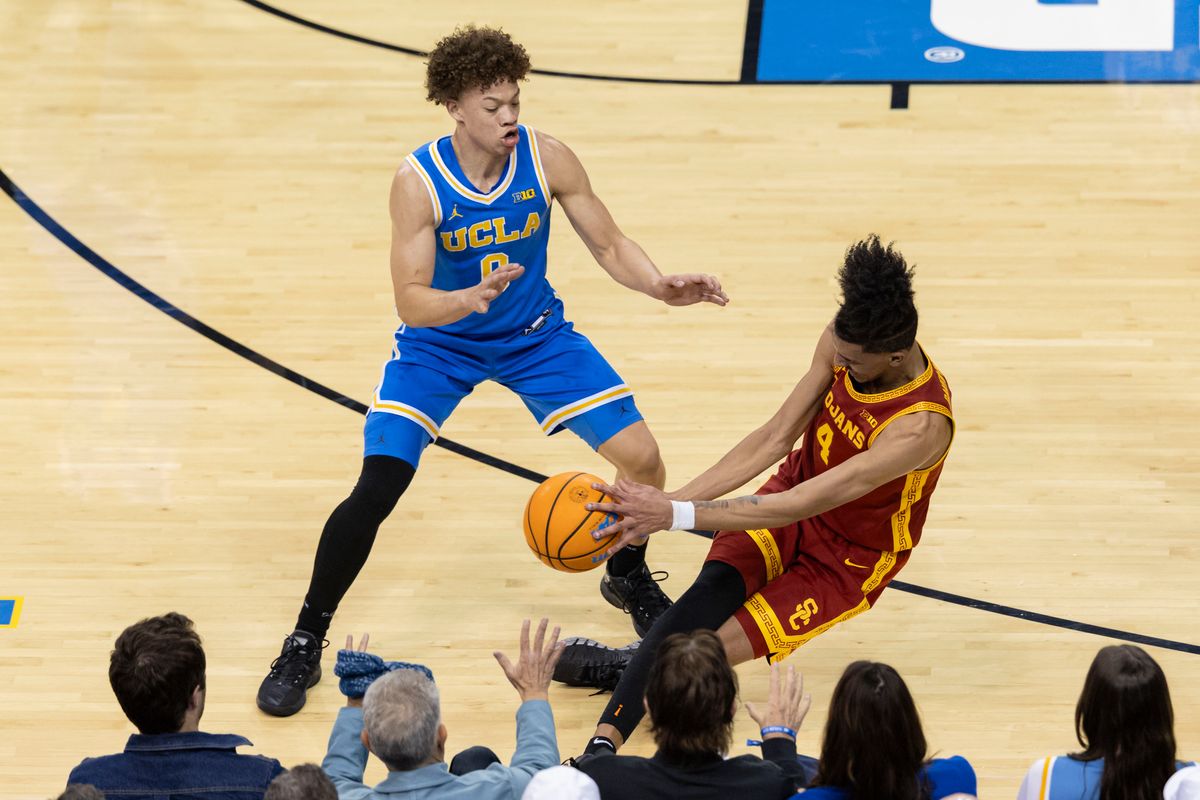 Chad Baker-Mazara #4 of the USC Trojans tries to save the ball during an NCAA basketball game against the UCLA Bruins, Tuesday February 24, 2026 in Los Angeles, Calif.