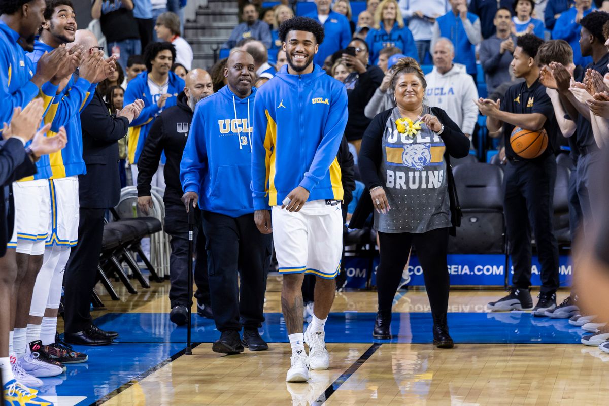 Donovan Dent #2 of the UCLA Bruins walks out with his parents during the senior night ceremony before an NCAA basketball game against the Nebraska Cornhuskers, Tuesday March 3, 2026 in Los Angeles, Calif. Donovan Dent #2 of the UCLA Bruins walks out with his parents during the senior night ceremony before an NCAA basketball game against the Nebraska Cornhuskers, Tuesday March 3, 2026 in Los Angeles, Calif.
