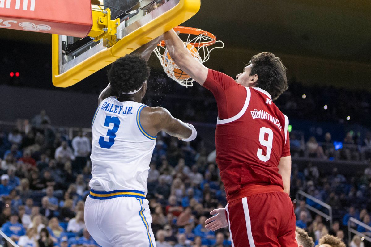 Eric Dailey Jr. #3 of the UCLA Bruins dunks the ball over Berke Büyüktuncel #9 of the Nebraska Cornhuskers during an NCAA basketball game, Tuesday March 3, 2026 in Los Angeles, Calif. Eric Dailey Jr. #3 of the UCLA Bruins dunks the ball over Berke Büyüktuncel #9 of the Nebraska Cornhuskers during an NCAA basketball game, Tuesday March 3, 2026 in Los Angeles, Calif.