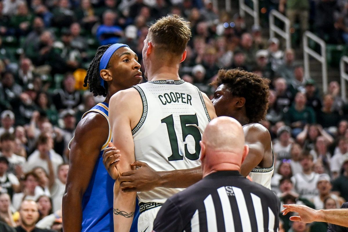 Michigan State's Carson Cooper, right, and UCLA's Steven Jamerson, left, stare each other down after Jamerson's flagrant foul on Cooper during the second half on Tuesday, Feb. 17, 2026, at the Breslin Center in East Lansing. Michigan State's Carson Cooper, right, and UCLA's Steven Jamerson, left, stare each other down after Jamerson's flagrant foul on Cooper during the second half on Tuesday, Feb. 17, 2026, at the Breslin Center in East Lansing.