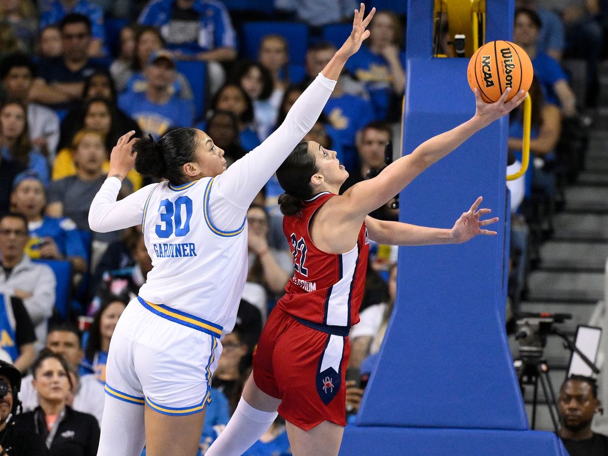 Mar 23, 2025; Los Angeles, California, USA; Richmond Spiders guard Rachel Ullstrom (22) puts up a shot past UCLA Bruins forward Timea Gardiner (30) during the second quarter of an NCAA Tournament second round game at Pauley Pavilion presented by Wescom. Mar 23, 2025; Los Angeles, California, USA; Richmond Spiders guard Rachel Ullstrom (22) puts up a shot past UCLA Bruins forward Timea Gardiner (30) during the second quarter of an NCAA Tournament second round game at Pauley Pavilion presented by Wescom.