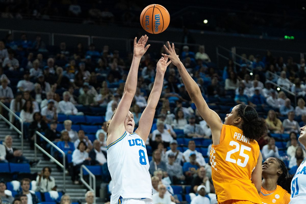 UCLA Bruins guard Gianna Kneepkens (8) shoots a tough shot over her defender during an NCAA basketball game against the Tennessee Lady Volunteers on Sunday, November 30, 2025 at Pauley Pavilion in Los Angeles, Calif. UCLA Bruins guard Gianna Kneepkens (8) shoots a tough shot over her defender during an NCAA basketball game against the Tennessee Lady Volunteers on Sunday, November 30, 2025 at Pauley Pavilion in Los Angeles, Calif.