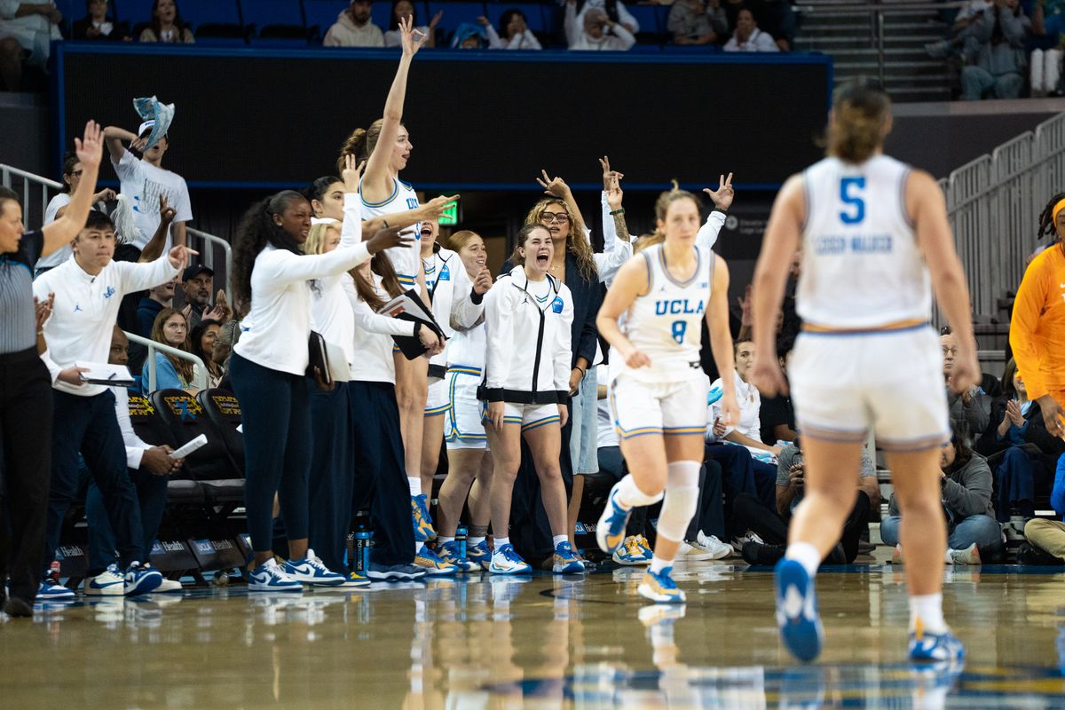 UCLA Bruins bench celebrates after Gianna Kneepkens (8) hits a corner three during an NCAA basketball game against the Tennessee Lady Volunteers on Sunday, November 30, 2025 at Pauley Pavilion in Los Angeles, Calif. UCLA Bruins bench celebrates after Gianna Kneepkens (8) hits a corner three during an NCAA basketball game against the Tennessee Lady Volunteers on Sunday, November 30, 2025 at Pauley Pavilion in Los Angeles, Calif.