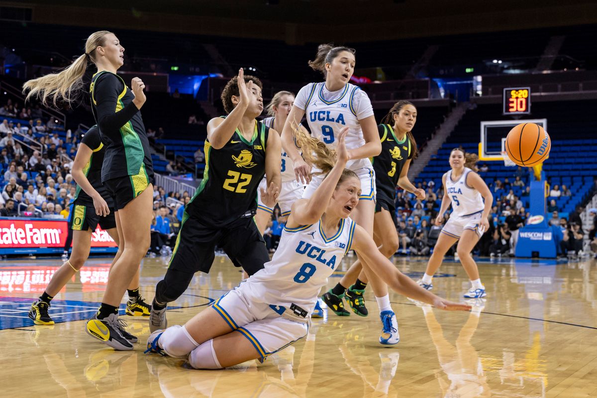 Guard Gianna Kneepkens #8 of the UCLA Bruins dives for the ball during an NCAA basketball game against the Oregon Ducks, Sunday December 7, 2025 in Los Angeles, Calif. Guard Gianna Kneepkens #8 of the UCLA Bruins dives for the ball during an NCAA basketball game against the Oregon Ducks, Sunday December 7, 2025 in Los Angeles, Calif.