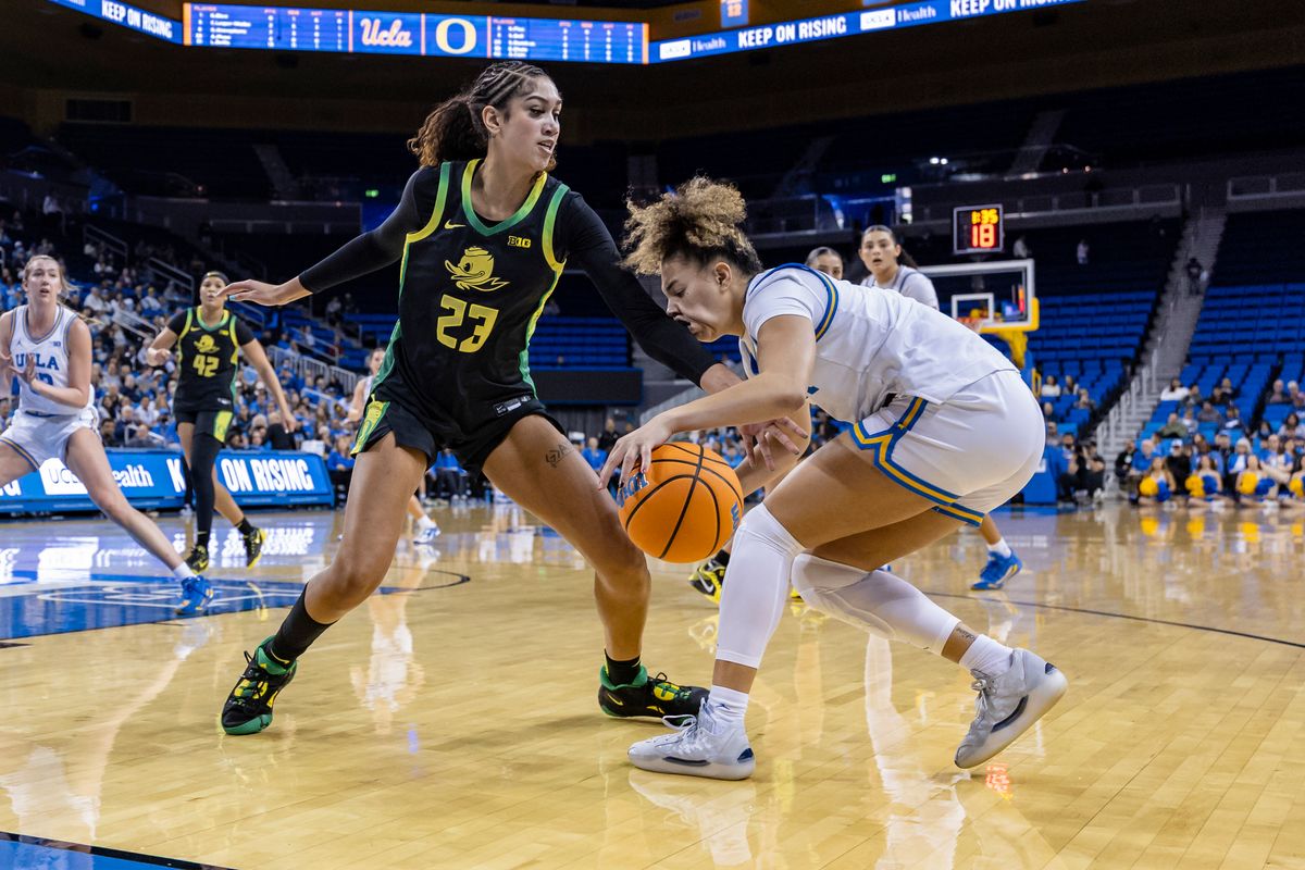Guard Kiki Rice #1 of the UCLA Bruins takes an elbow to the face from forward Sarah Rambus #23 of the Oregon Ducks while handling the ball during an NCAA basketball game, Sunday December 7, 2025 in Los Angeles, Calif. Guard Kiki Rice #1 of the UCLA Bruins takes an elbow to the face from forward Sarah Rambus #23 of the Oregon Ducks while handling the ball during an NCAA basketball game, Sunday December 7, 2025 in Los Angeles, Calif.