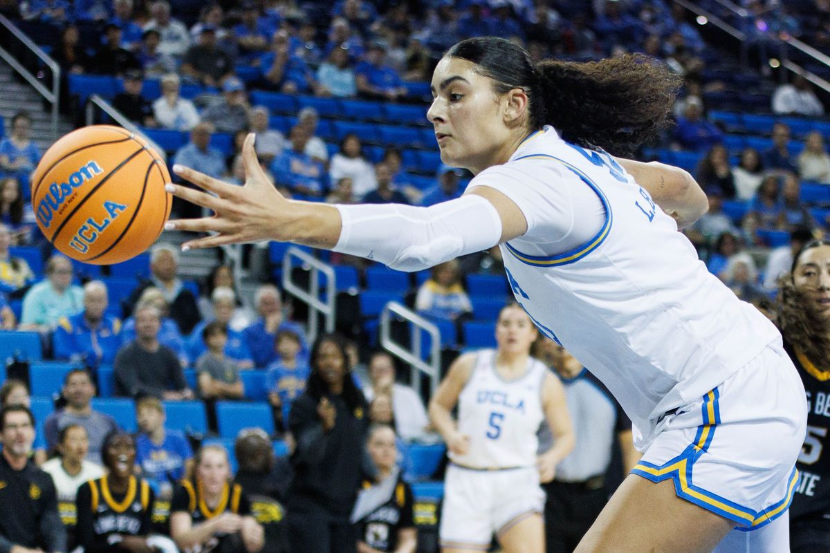 UCLA Bruins center Lauren Betts (51) reaches for the ball during an NCAA basketball game against the Long Beach State, Saturday December 20, 2025 in Los Angeles, Calif. UCLA Bruins center Lauren Betts (51) reaches for the ball during an NCAA basketball game against the Long Beach State, Saturday December 20, 2025 in Los Angeles, Calif.